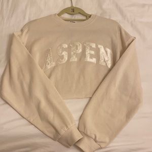 XS tinted ivory cropped crewneck from Garage.